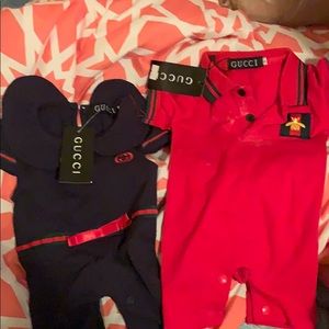 Two baby Gucci onesies
